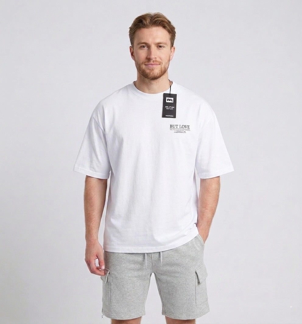 Men's white oversized T-shirt featuring a "No Money But Love" floral and butterfly graphic print on the back.