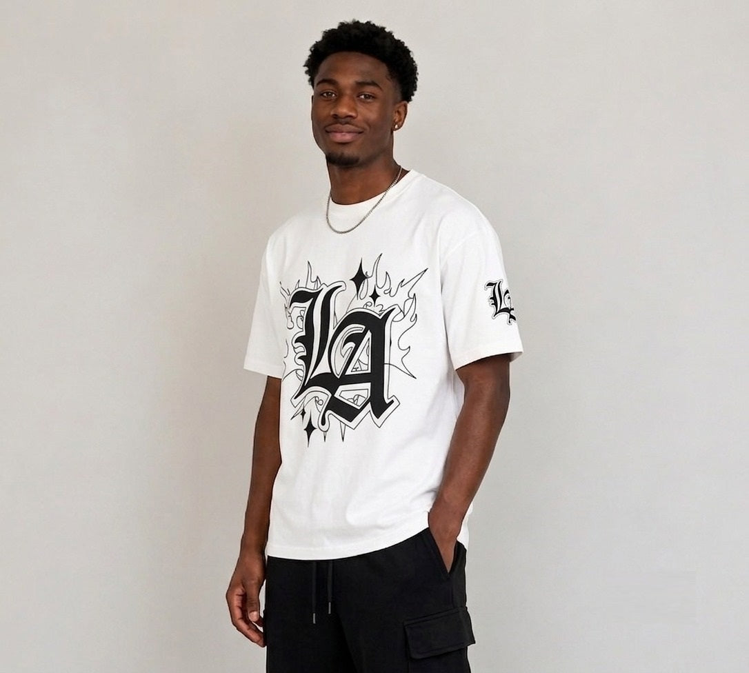White oversized drop shoulder T-shirt for men featuring bold LA gothic graphic print, UK streetwear fashion style.