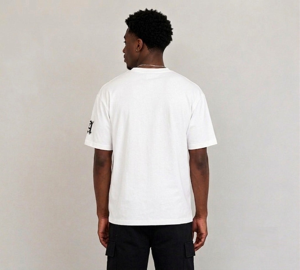 White oversized drop shoulder T-shirt for men featuring bold LA gothic graphic print, UK streetwear fashion style.