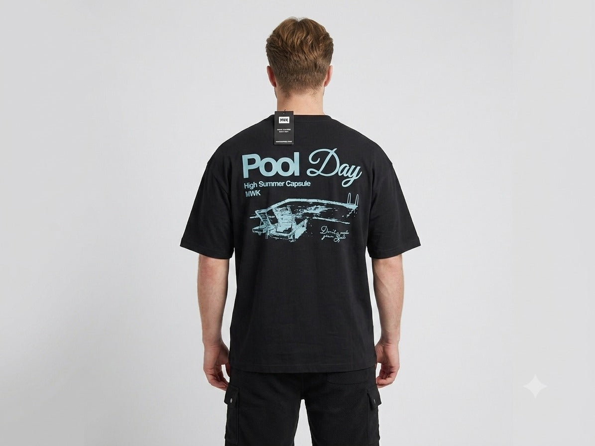 Men's black oversized T-shirt with a retro "Pool Day" graphic and poolside illustration printed on the back. uk